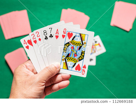 playing cards on poker table 112669188