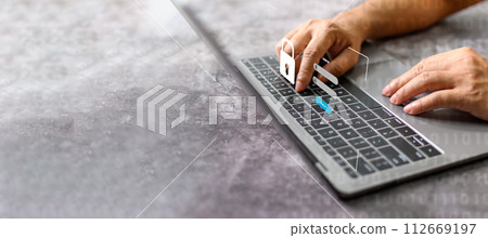 Men typing on keyboard to sign in computer network. Laptop screen showing login for security system. Concept work at home with computers and Internet. Notebook computer on white table. blur background Men typing on keyboard to sign in computer network. Laptop screen showing login for security system. Concept work at home with computers and Internet. Notebook computer on white table. blur background 112669197