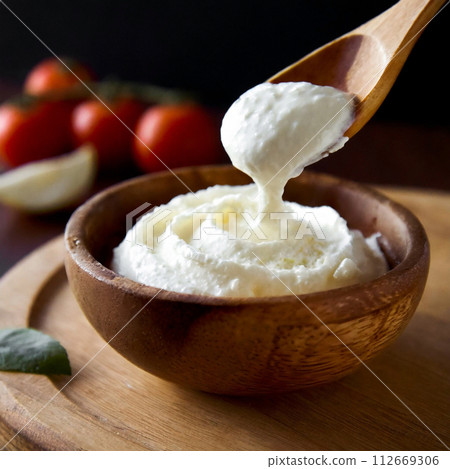 fresh cheese in a wooden bowl fresh cheese in a wooden bowl 112669306