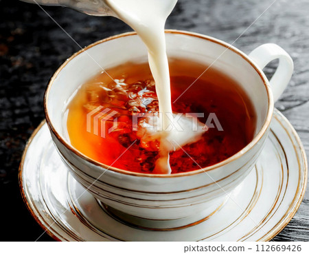 The moment you add milk to tea The moment you add milk to tea 112669426