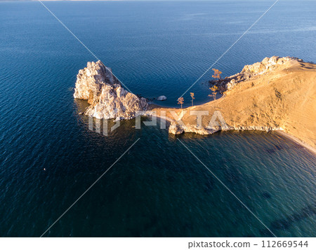 Shamanka Rock. Lake Baikal at Olkhon Island. the village of Khuzhir Shamanka Rock. Lake Baikal at Olkhon Island. the village of Khuzhir 112669544