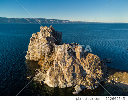 Shamanka Rock. Lake Baikal at Olkhon Island. the village of Khuzhir Shamanka Rock. Lake Baikal at Olkhon Island. the village of Khuzhir 112669545