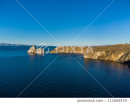 Shamanka Rock. Lake Baikal at Olkhon Island. the village of Khuzhir Shamanka Rock. Lake Baikal at Olkhon Island. the village of Khuzhir 112669559