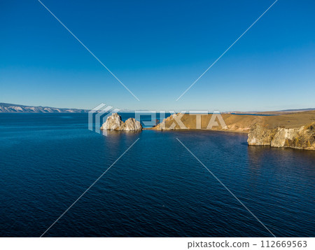 Shamanka Rock. Lake Baikal at Olkhon Island. the village of Khuzhir Shamanka Rock. Lake Baikal at Olkhon Island. the village of Khuzhir 112669563