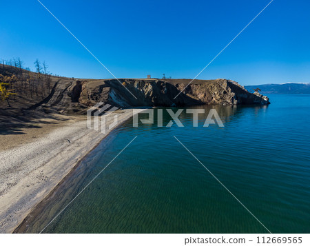 Sarayskiy beach. Shamanka Rock. Lake Baikal at Olkhon Island. the village of Khuzhir Sarayskiy beach. Shamanka Rock. Lake Baikal at Olkhon Island. the village of Khuzhir 112669565
