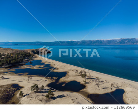 Sarayskiy beach. Shamanka Rock. Lake Baikal at Olkhon Island. the village of Khuzhir 112669569