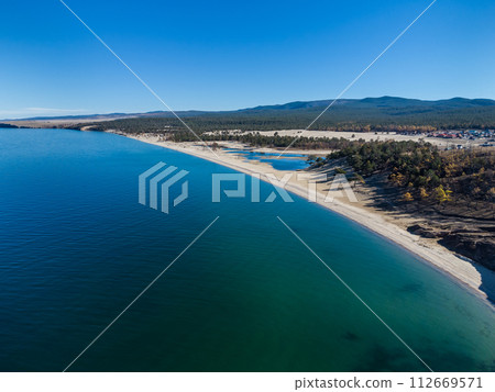 Sarayskiy beach. Shamanka Rock. Lake Baikal at Olkhon Island. the village of Khuzhir Sarayskiy beach. Shamanka Rock. Lake Baikal at Olkhon Island. the village of Khuzhir 112669571