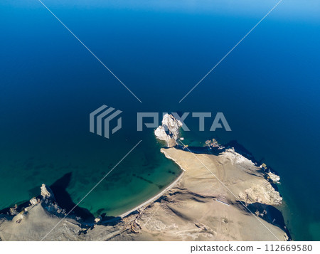 Sarayskiy beach. Shamanka Rock. Lake Baikal at Olkhon Island. the village of Khuzhir Sarayskiy beach. Shamanka Rock. Lake Baikal at Olkhon Island. the village of Khuzhir 112669580