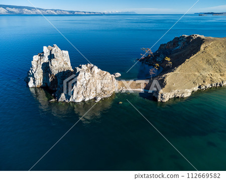 Sarayskiy beach. Shamanka Rock. Lake Baikal at Olkhon Island. the village of Khuzhir Sarayskiy beach. Shamanka Rock. Lake Baikal at Olkhon Island. the village of Khuzhir 112669582