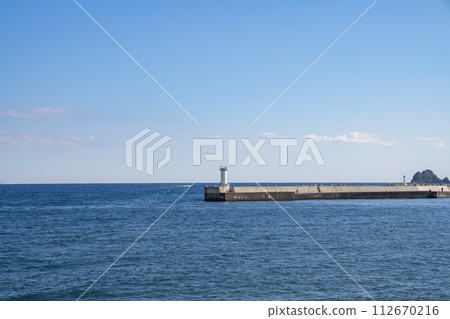 pier sea waves breakwater blue sky sunny pier sea waves breakwater blue sky sunny 112670216