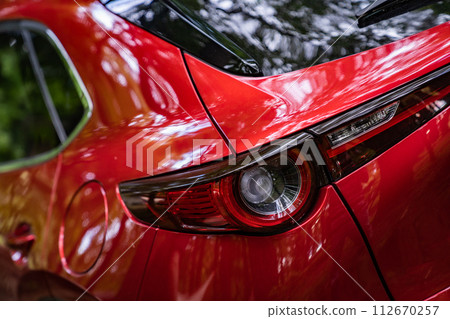 red car japanese car drive 112670257