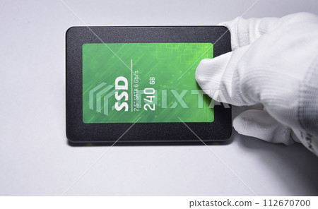 Close-up photo of 2.5" SSD hard drive, empty on white background. 112670700