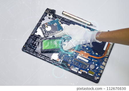 top view while mechanic repairing Motherboard top view while mechanic repairing Motherboard 112670830