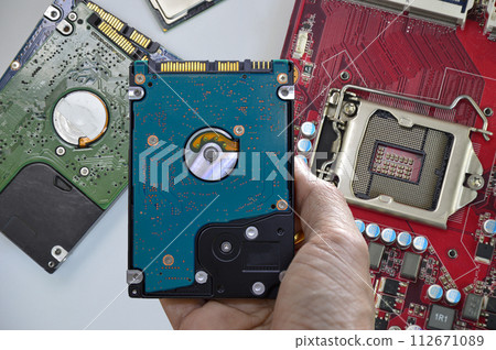 Hard disk drives are still widely used. hard drive in hand 112671089