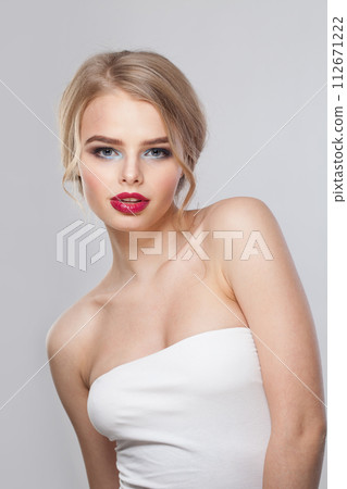 Beautiful blonde lady on white background. Beautiful blond woman studio portrait 112671222