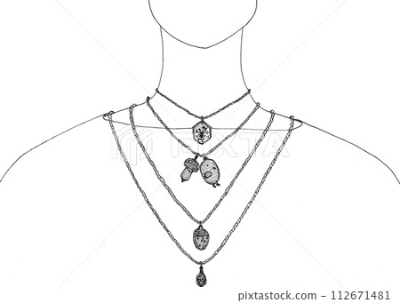 different pendants on chains on a woman's neck 112671481