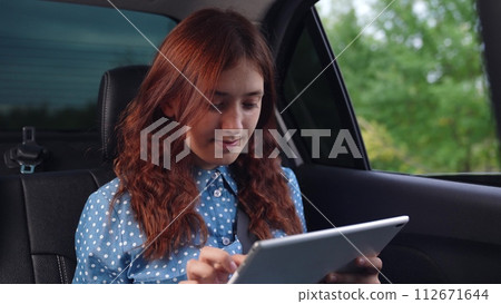 girl tablet car face smile window, car trip learning, journey digital education, serene vacation education, backseat academic pursuit, hand on tablet, student using tablet, car travel student, tablet girl tablet car face smile window, car trip learning, journey digital education, serene vacation education, backseat academic pursuit, hand on tablet, student using tablet, car travel student, tablet 112671644