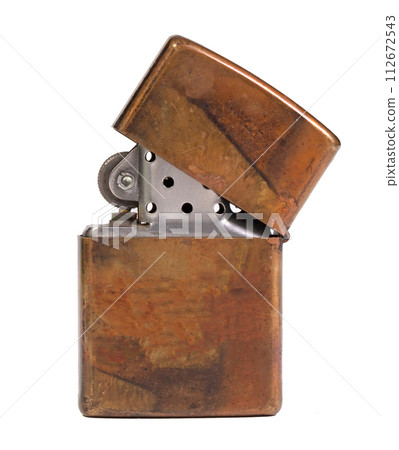 Used vintage metal lighter isolated on white background Used vintage metal lighter isolated on white background 112672543