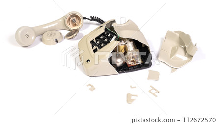 Part of a broken old telephone, phone with dial plate - plastic phone 112672570