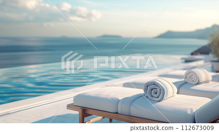 Sunbeds with towels by the pool with sea views. 112673009