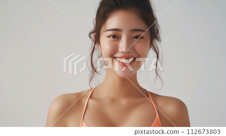 Asian woman wearing bikini on white background. 112673803