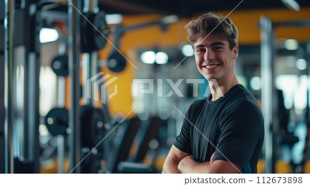Caucasian man in exercise clothes smiling confidently in the gym. 112673898
