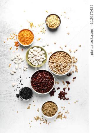 Various types of legumes, beans, lentils, chickpeas and peas, top view 112675425