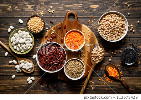 Various types of legumes, beans, lentils, chickpeas and peas, top view 112675429