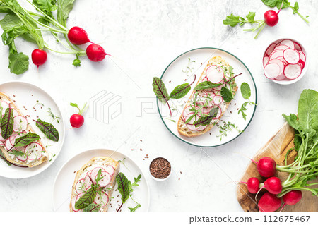 Radish sandwiches with cottage cheese and fresh green leaves, top down view Radish sandwiches with cottage cheese and fresh green leaves, top down view 112675467