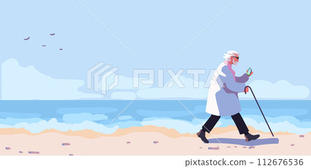 An elderly man in a raincoat with an umbrella on the beach on a sunny day. Shore with beach and waves. Ocean view poster. Blue sky with clouds over the sea. Background for poster, banner and flyer 112676536