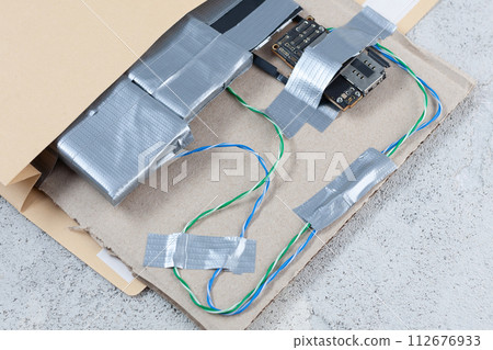 Mail bomb IED - Improvised Explosive Device with c4 and cell phone module in envelope Mail bomb IED - Improvised Explosive Device with c4 and cell phone module in envelope 112676933