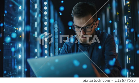 A focused young man engrossed in his work on a laptop computer, Ai Generated 112677556