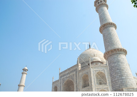 Side view of majestic Taj Mahal in Agra. One of seven wonders of the World Side view of majestic Taj Mahal in Agra. One of seven wonders of the World 112678025
