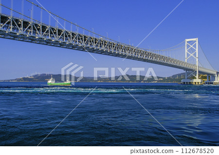 Cargo ship and Naruto Ohashi Bridge Cargo ship and Naruto Ohashi Bridge 112678520
