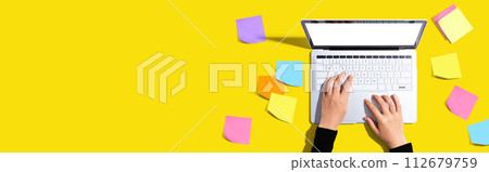 Laptop computer with many sticky notes Laptop computer with many sticky notes 112679759