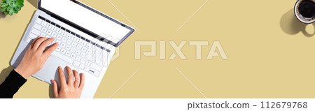 Person using a laptop computer 112679768