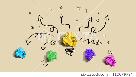 Brainstorming concept with a crumpled paper light bulb 112679784