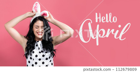 Hello April message with woman with Easter theme Hello April message with woman with Easter theme 112679809