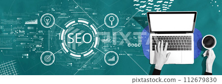 SEO concept with person using a laptop SEO concept with person using a laptop 112679830