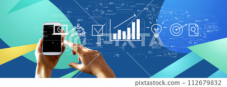 Marketing concept with person using smartphone Marketing concept with person using smartphone 112679832