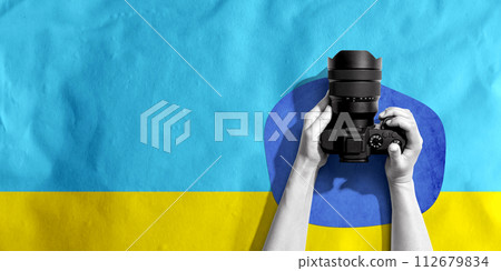 Person holding a SLR camera Person holding a SLR camera 112679834