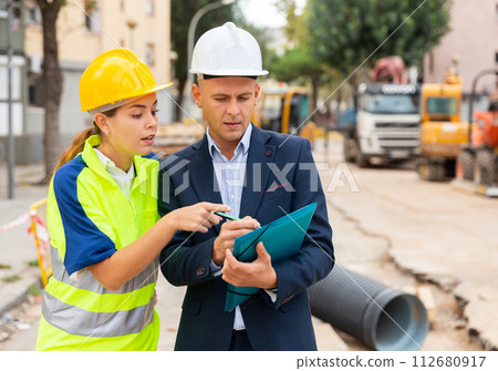 Civil engineers checking work process in construction site Civil engineers checking work process in construction site 112680917