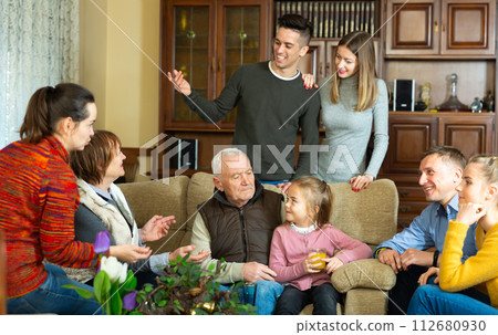 Big friendly family chatting at home Big friendly family chatting at home 112680930