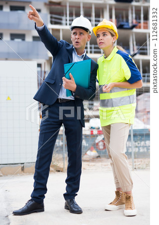 Civil engineers checking work process in construction site Civil engineers checking work process in construction site 112681332