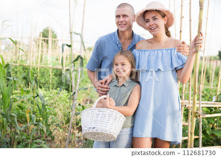 Family in kitchen garden Family in kitchen garden 112681730