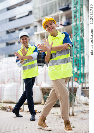 Portrait of two active positive civil engineers Portrait of two active positive civil engineers 112681789
