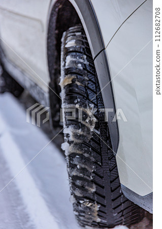 Four-wheel drive vehicles and all-season tires allow you to drive safely on snowy roads Four-wheel drive vehicles and all-season tires allow you to drive safely on snowy roads 112682708