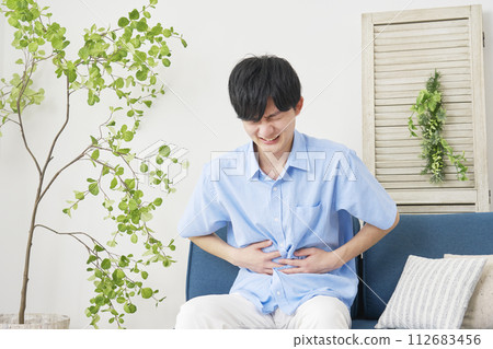 young man with stomachache 112683456