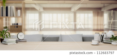 A space for displaying products on a wooden tabletop in a contemporary living room. A space for displaying products on a wooden tabletop in a contemporary living room. 112683797