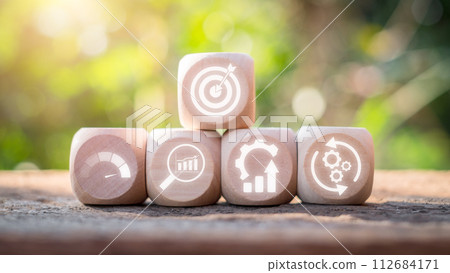 DMAIC concept, Wooden block on desk with DMAIC icon on virtual screen. DMAIC concept, Wooden block on desk with DMAIC icon on virtual screen. 112684171
